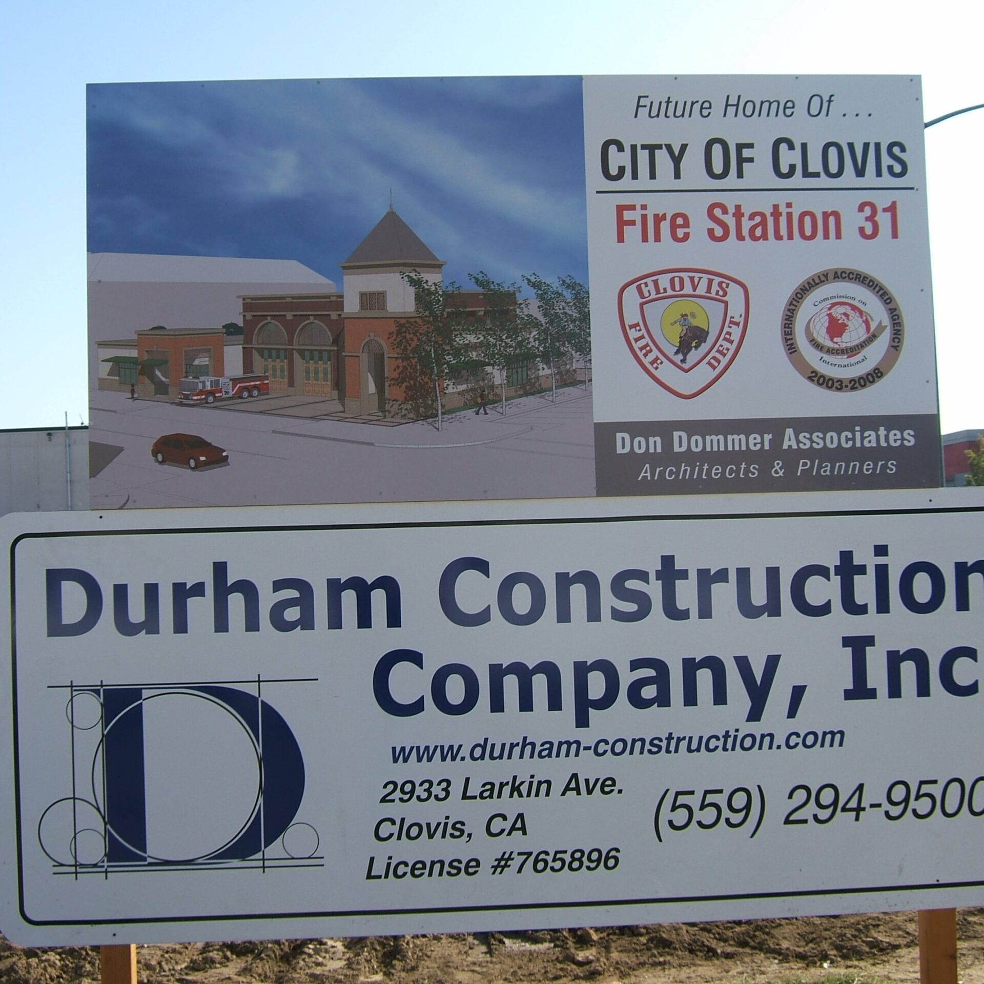 A large construction sign on a dirt lot. The top portion shows a rendering of the future fire station and reads "Future Home Of ... CITY OF CLOVIS Fire Station 31." The bottom portion is for the contractor, Durham Construction Company, Inc.
